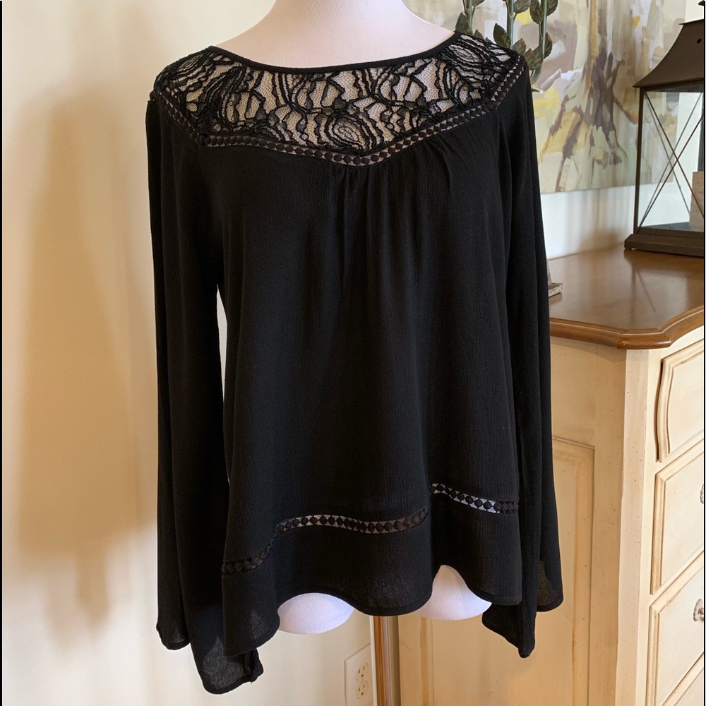 Women’s Size S black top. Flared sleeves.
